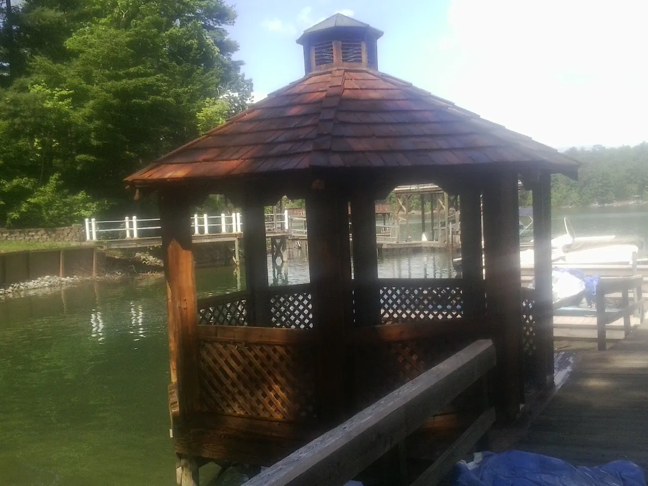 Cedar shake gazebo roof rebuilt on a lake dock in Tipp City